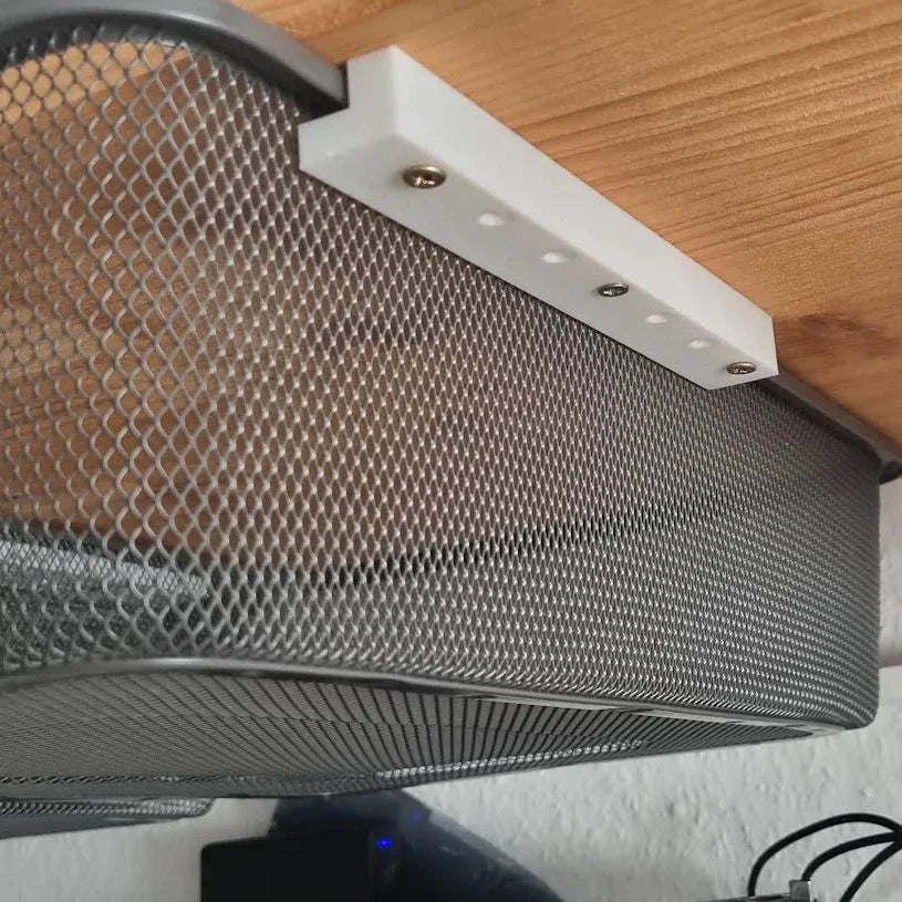 Mesh screen on a wooden surface with tools in the background