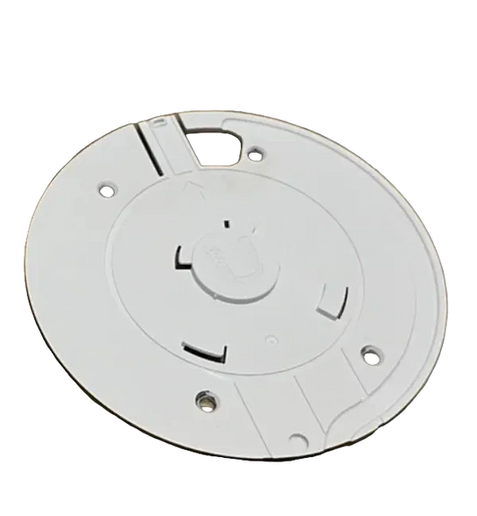 White security camera and mounting bracket on a wooden surface